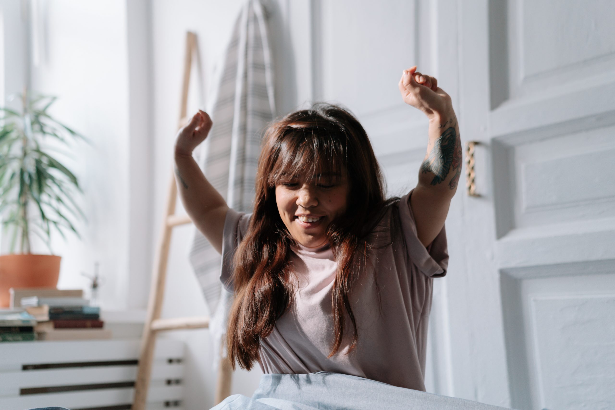 Person stretching to wake up.