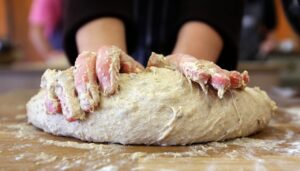 baker kneading dough